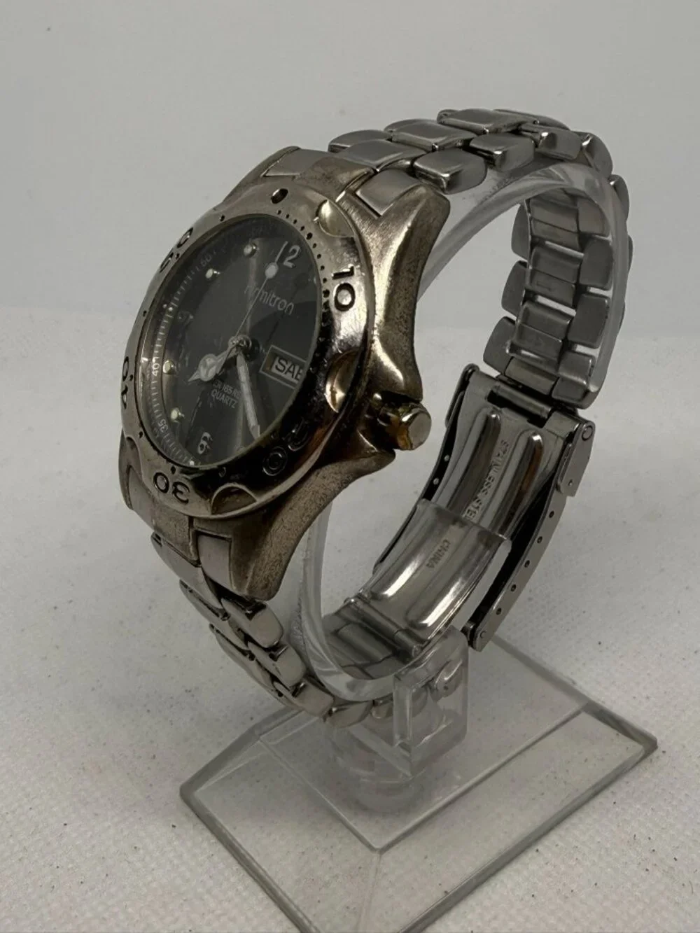 Armitron Men's SS Rotating Bezel Dark Grey Dial Day Date Bracelet Quartz Watch